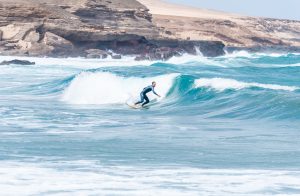 front view of surfer riding a wave in a sunny day 2024 12 06 09 38 12 utc (1)